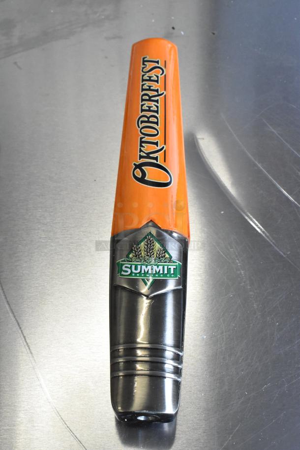 Brand new Oktoberfest tap handle by Summit Brewing Co., featuring a vibrant orange design with logo, unused condition.