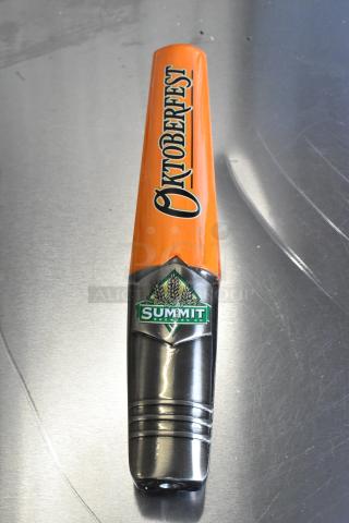 Brand new Oktoberfest tap handle by Summit Brewing Co., featuring a vibrant orange design with logo, unused condition.
