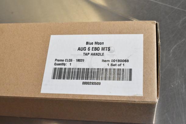 New Blue Moon tap handle in box, labeled "AUG 6 EBO MTS," promo CLQ5-18029, item 00180068, quantity 1.