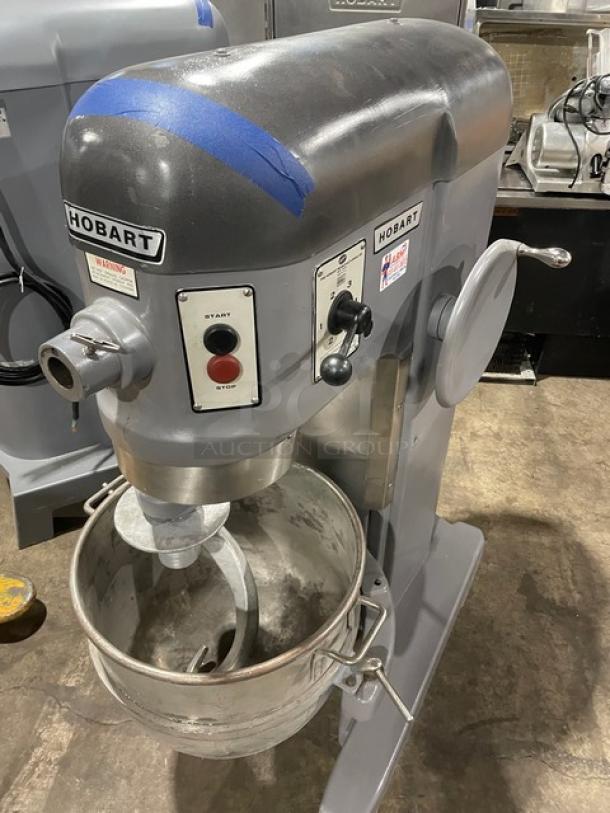 Hobart H600 60 Qt. planetary mixer with mixing bowl, spiral dough hook, and start/stop controls; 208V 3 phase, on legs.