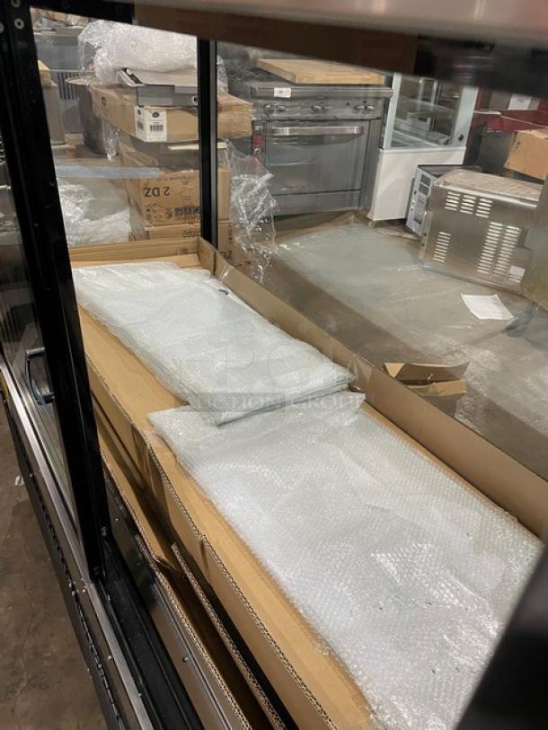 Omcan 60" refrigerated bakery display case, model RSCN0471S, stainless steel, scratch-n-dent, on casters, tags visible.