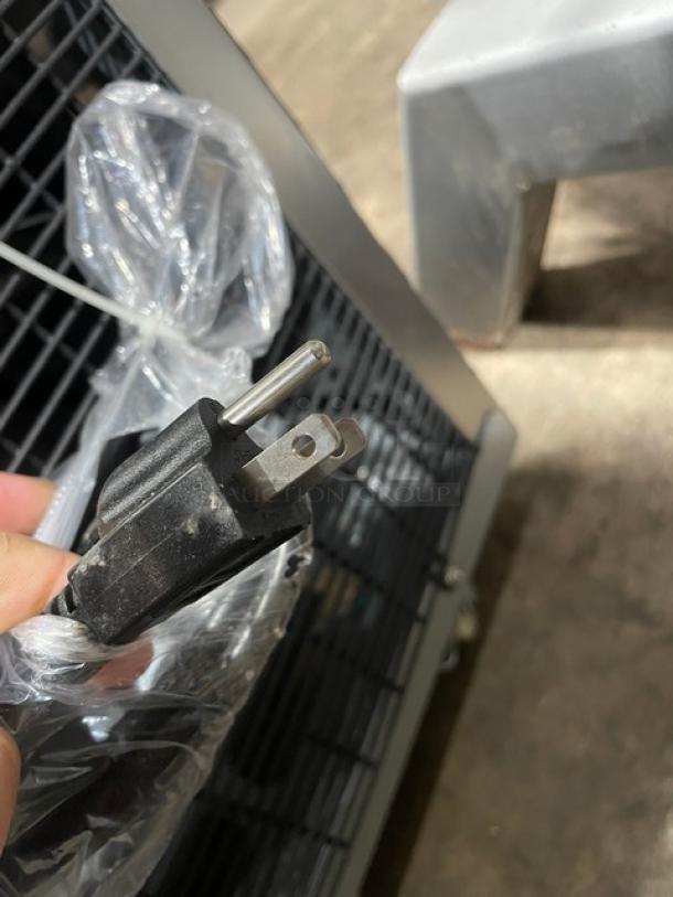 Omcan commercial stainless steel refrigerated display case, Model RSCN0471S, with a power plug shown.