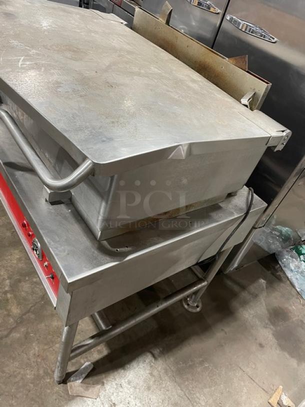 Vulcan stainless steel natural gas braising pan on legs, tilted skillet design. Good condition, ideal for commercial use.