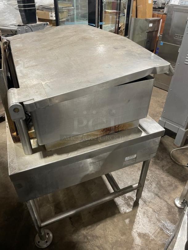 Vulcan commercial stainless steel natural gas-powered tilt braising pan on legs, features adjustable tilt, used condition.