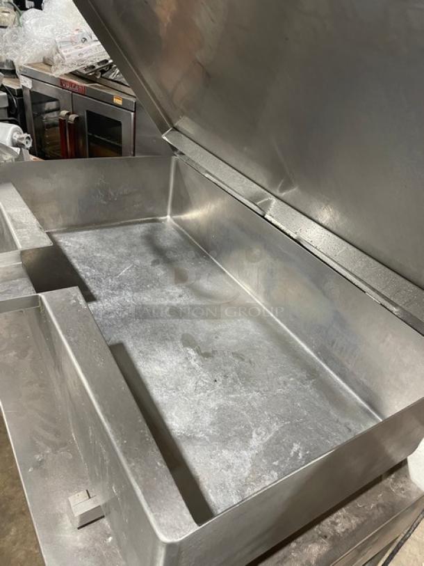 Vulcan commercial stainless steel gas-powered tilted braising pan, ultra tilt skillet, in fair condition, on legs.