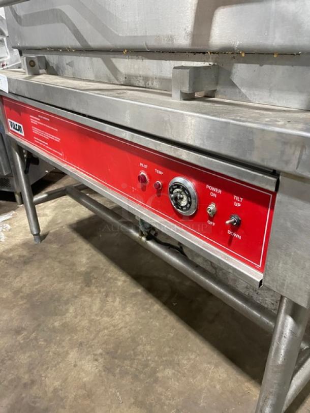 Vulcan commercial stainless steel tilted braising pan, natural gas powered, on legs. Features temperature control panel.