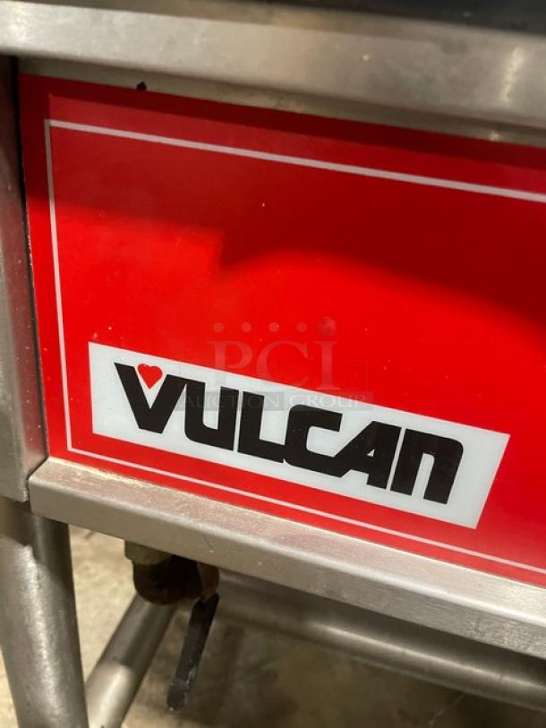 Vulcan commercial stainless steel gas braising pan with tilt feature, on legs. Brand label visible.