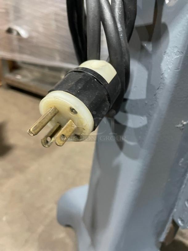 Hobart Commercial Electric Planetary Mixer with mixing bowl, heavy-duty, on legs, sturdy power cord, in good condition.