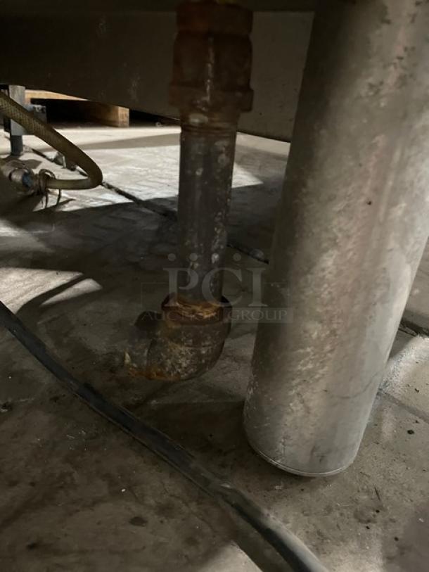 Rusty pipe and metal legs beneath Alto-Shaam Combitherm 2020G combi oven, natural gas connection visible.