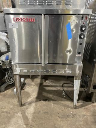 Blodgett commercial stainless steel single stack convection oven, natural gas, with wired rack, on legs, features visible wear.