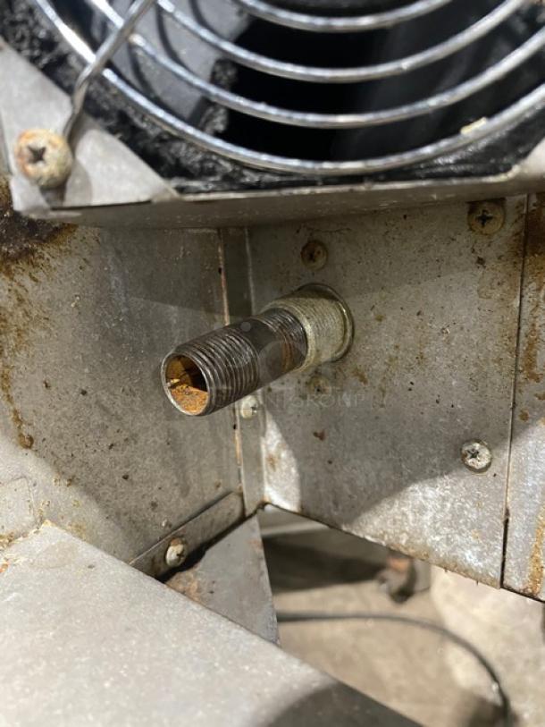 Blodgett stainless steel convection oven gas connector, slightly rusted, showing wiring and metal framework detail.
