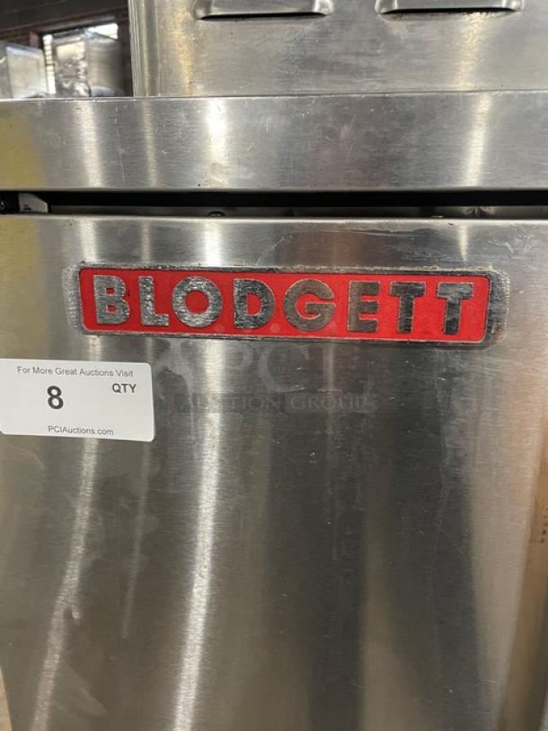 Blodgett stainless steel natural gas convection oven, single stack, on legs, with wired rack, branding visible.