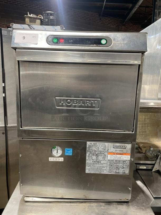 Hobart LXi Series stainless steel undercounter dishwasher, Energy Star certified, electric-powered, with control panel and safety labels.