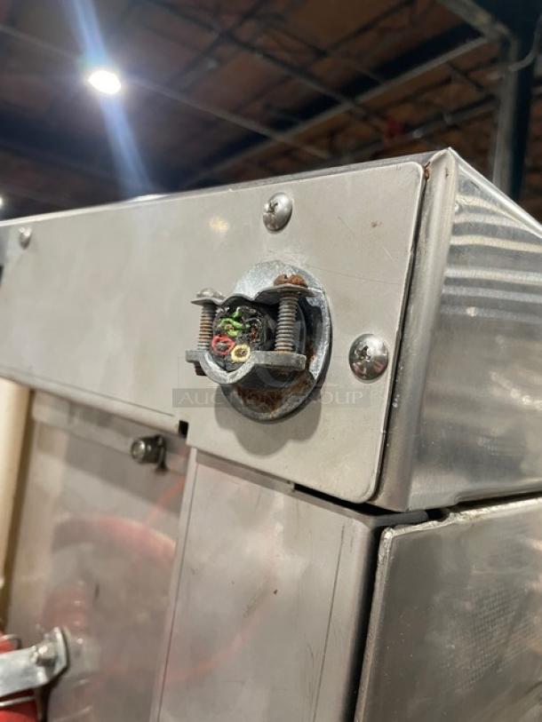 Hobart LXi Series stainless steel undercounter dishwasher, energy-efficient, used. Visible wear and wiring on top panel.