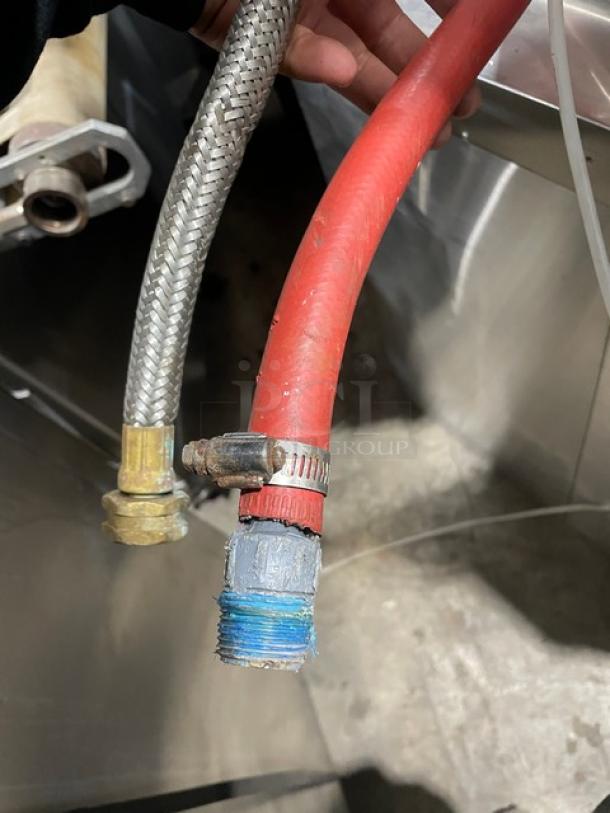 Hobart LXi dishwasher hoses, braided stainless steel and red rubber, attached with metal clamps. Condition: used.
