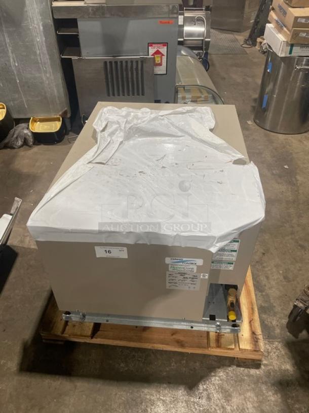 Heatcraft CZT025M6D condensing unit, 460V 3-phase. Covered with plastic wrap. Visible label with model and serial number.