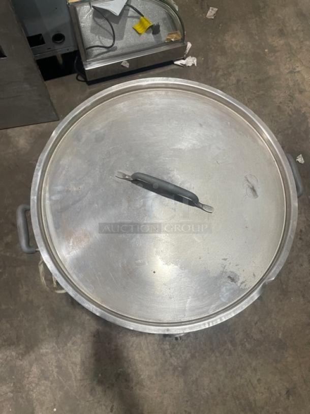 Cold Brew Avenue commercial stainless steel cold brew coffee maker, with cover and handles, shown from above. Slight wear visible.