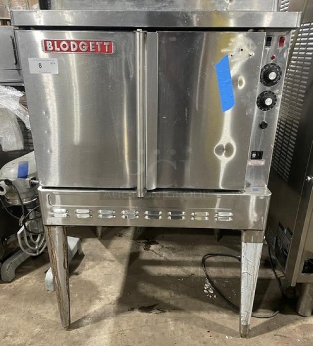 Blodgett commercial stainless steel single stack convection oven, natural gas, with wired rack, on legs, features visible wear.