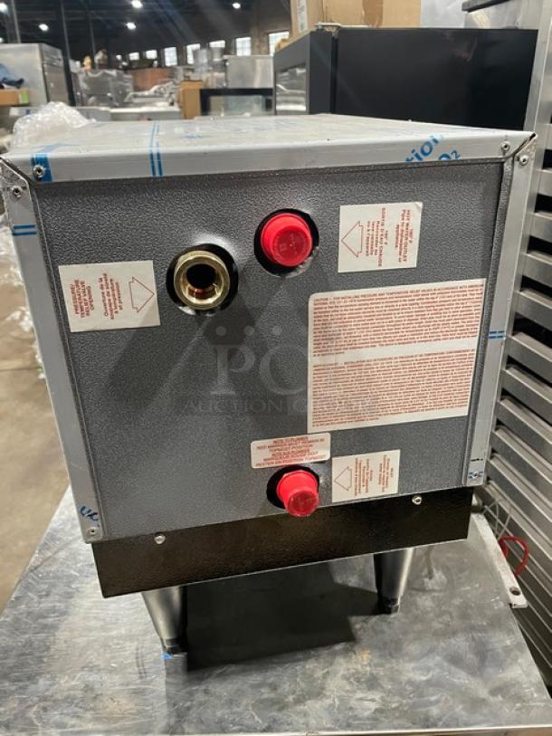 Hatco C15 stainless steel electric booster water heater, model 2023, 240V, 3-phase, on legs, labeled with usage instructions.