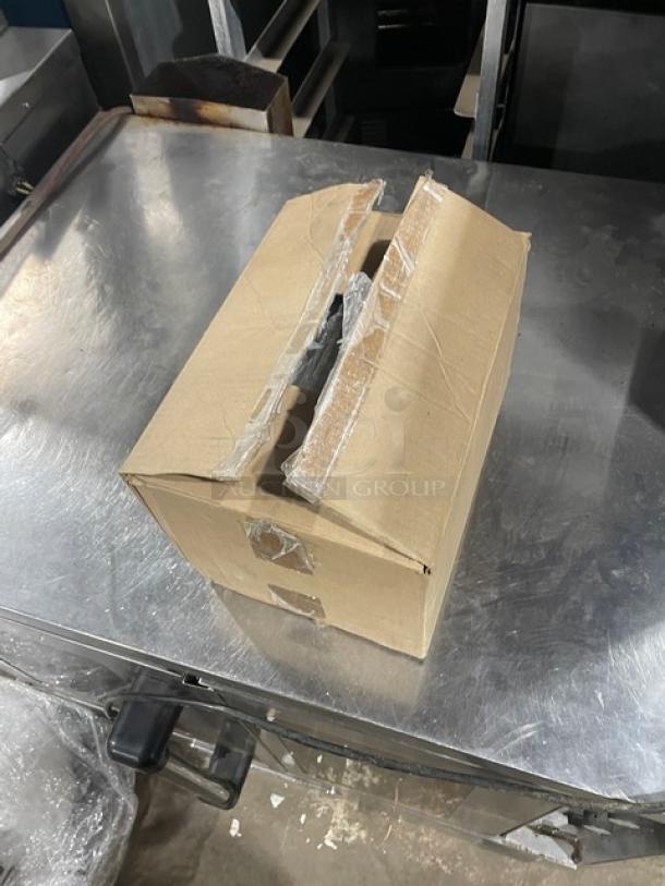 Cardboard box containing ABC Commercial Stainless Steel 1/3-Size Steamtable Pan, Model 222034931. Item is new and sealed.