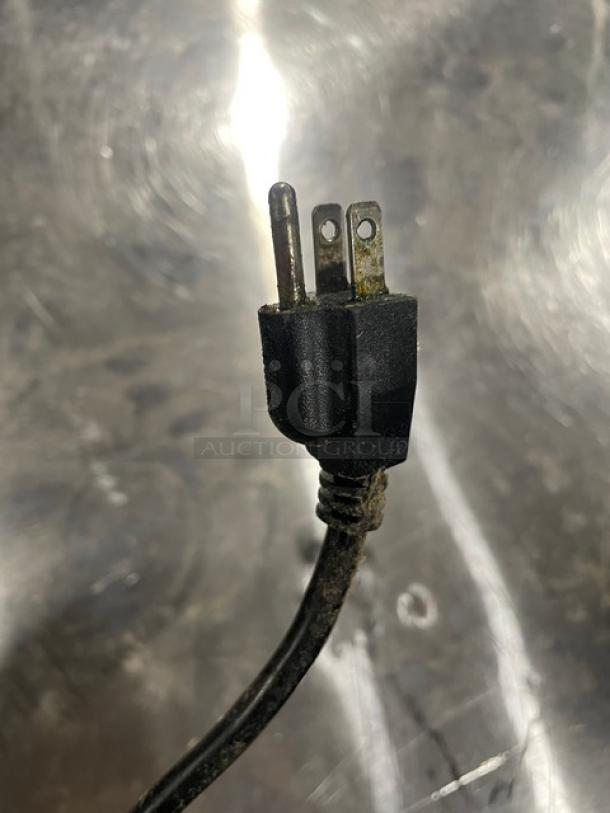 A close-up of a power plug, likely part of the Southbend SL-Series Convection Oven. The plug has some wear and dirt.
