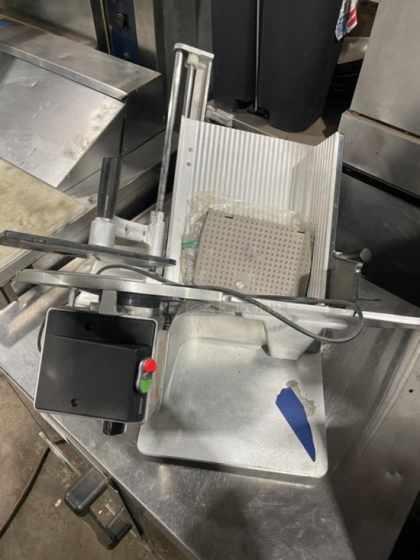 Bizerba commercial electric deli meat slicer on legs, countertop model. Features adjustable blade and safety guard. Used condition.