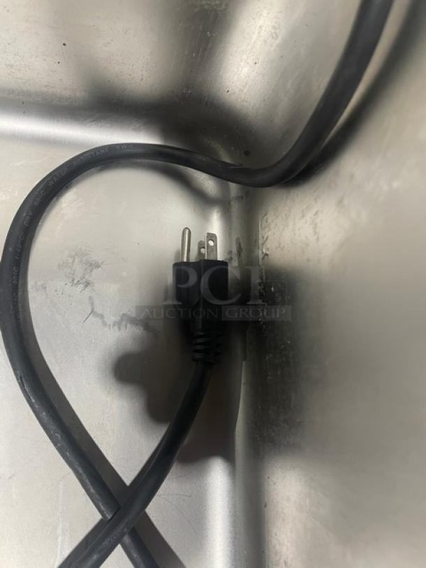 Crestware stainless steel electric food warmer, single well, countertop model, with power cord.