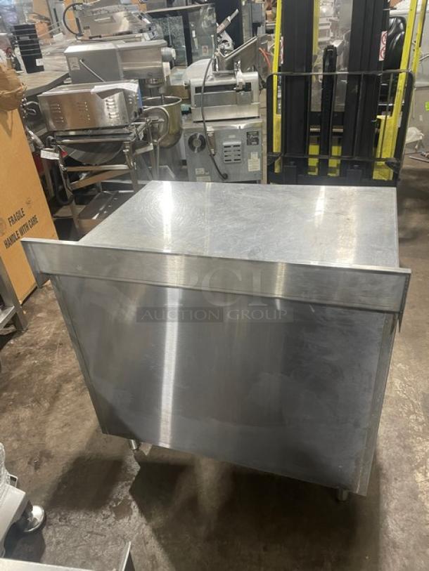 Eagle Group stainless steel worktable, 30"x36", enclosed cabinet base, upturned backsplash, model CB3036SEBSCS, on legs.