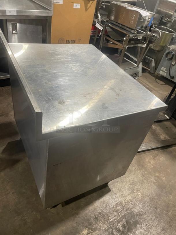 Eagle Group stainless steel worktable, 30"x36", with enclosed cabinet and up-turned back splash. Model CB3036SE-BS-CS.