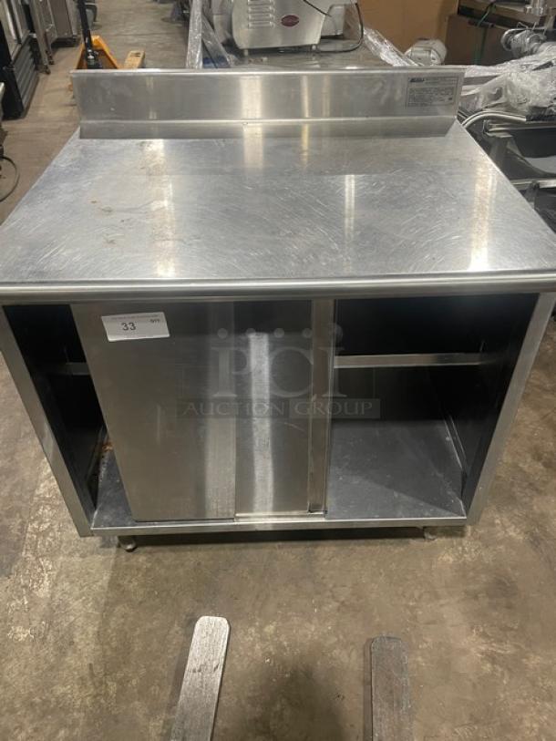 Eagle Group stainless steel worktable, 30"x36", model CB3036SEBSCS, enclosed cabinet base, up-turned backsplash, on legs.