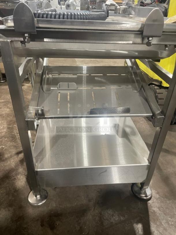 M&E Pro Series stainless steel deli cart with single undershelf, slicer-mount top, legs, and casters. Excellent condition.