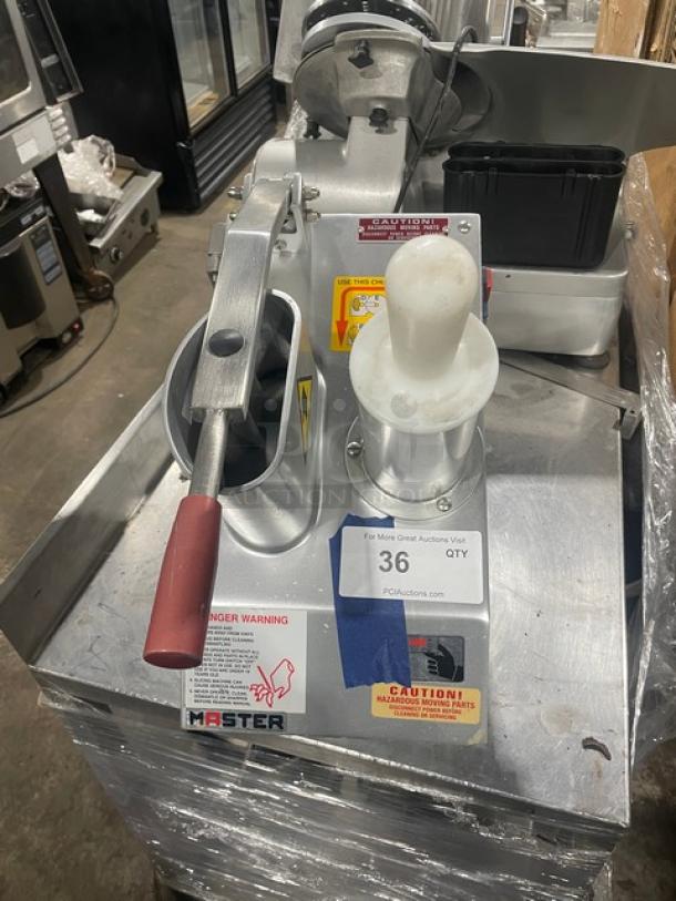 Fleetwood MASTER stainless steel vegetable cutter, electric-powered, countertop model, SN: D9711821, 115V, 1 Phase, on legs.