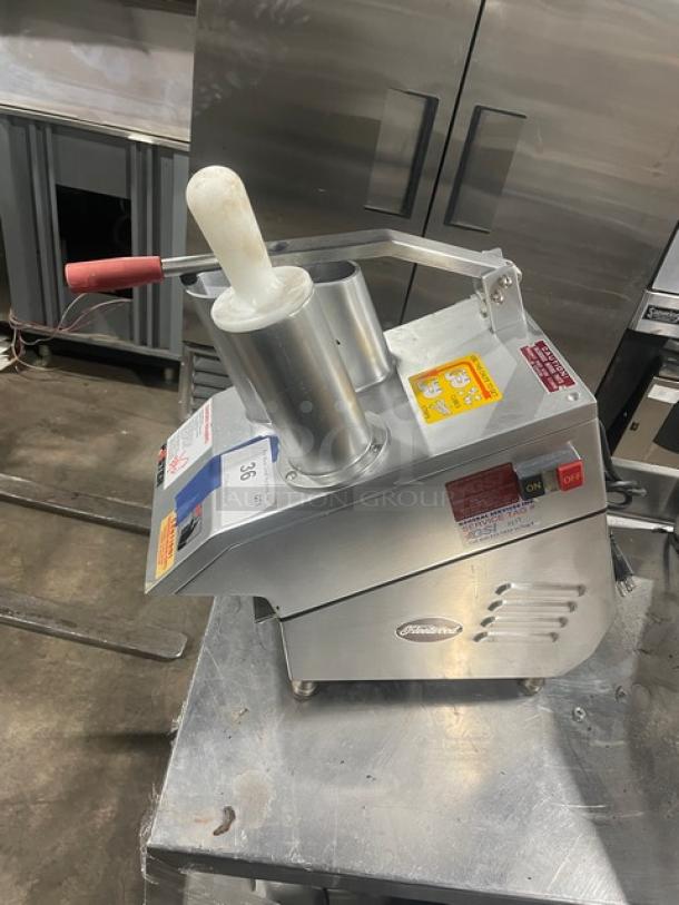 Fleetwood MASTER stainless steel vegetable cutter, slicer, and dicer. Electric, countertop model on legs, 115V, 1 phase.