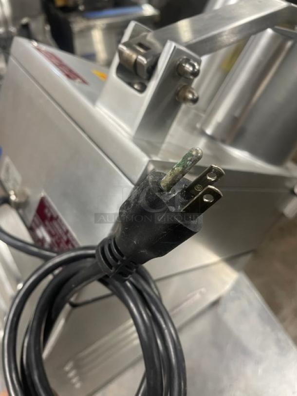 Fleetwood MASTER stainless steel electric countertop food processor, model D9711821, 115V, on legs, with a power cord.