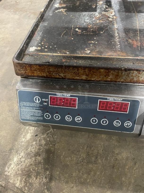 Commercial stainless steel electric countertop dual panini press grill on legs, digital controls, used condition.