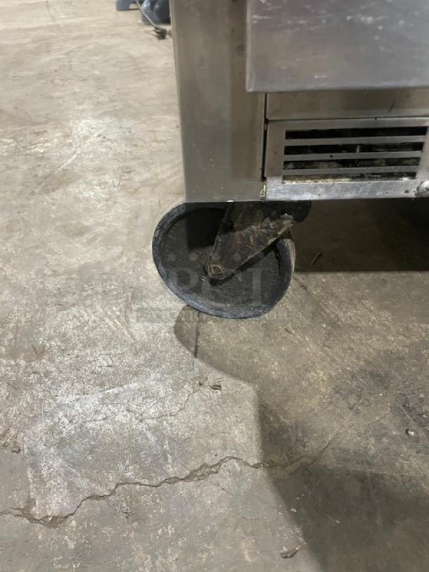 Beverage-Air stainless steel 2-drawer undercounter refrigerator, model WTRD27A, on casters, shows wear on wheels.