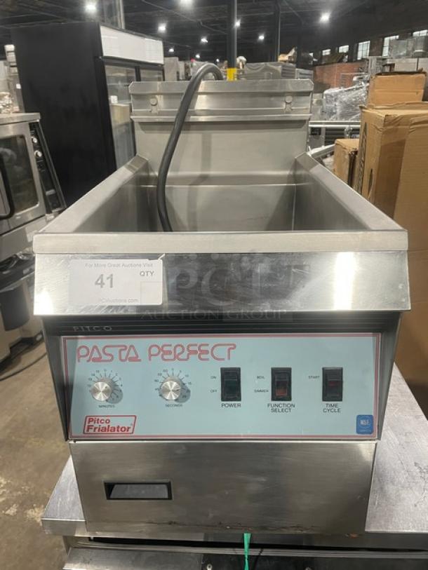 Pitco Frialator Pasta Perfect electric countertop pasta cooker in stainless steel, with backsplash and basket hanger.