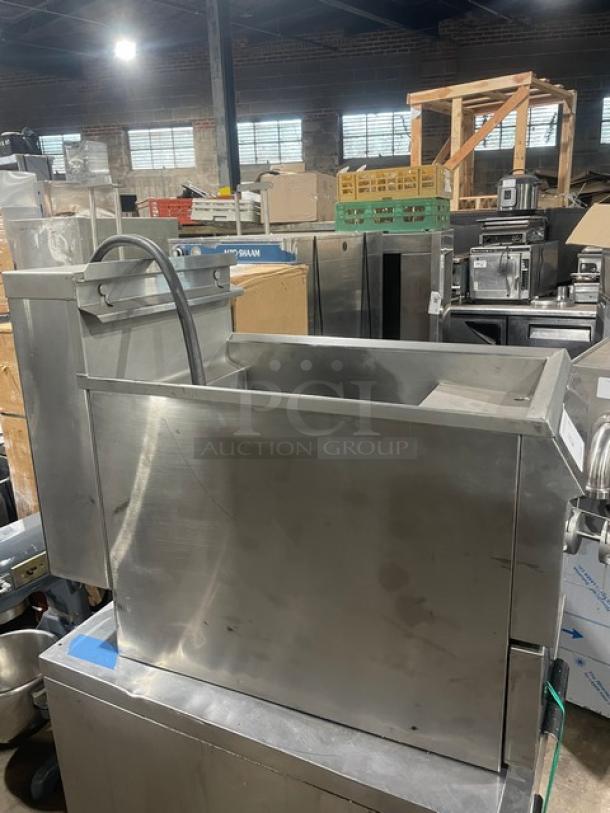 Pitco Frialator Pasta Perfect Series stainless steel electric countertop pasta cooker with back splash and basket hanger.