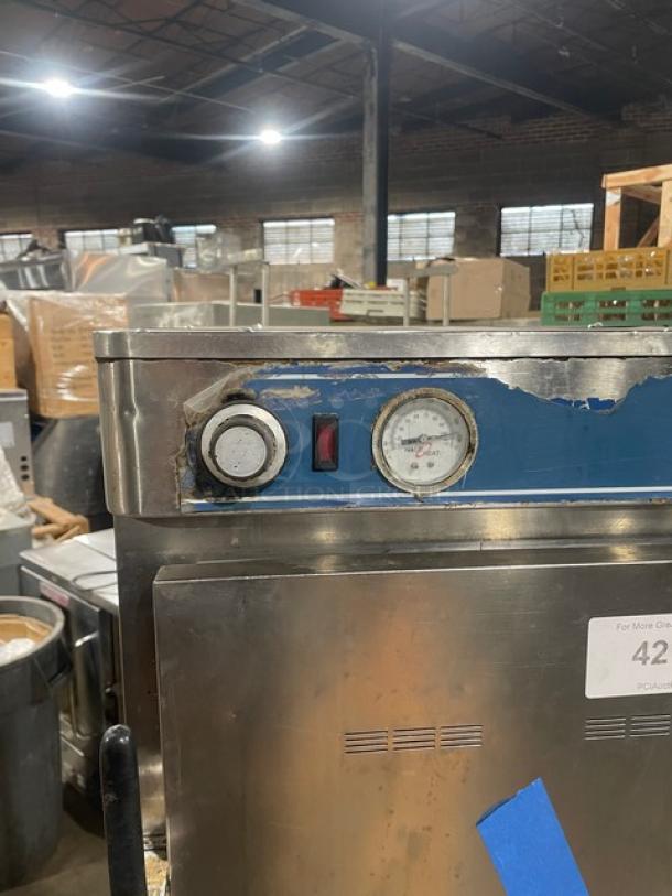 Alto-Shaam Halo Heat Series stainless steel double-stacked cook/hold oven with wired rack, on casters, control panel visible.