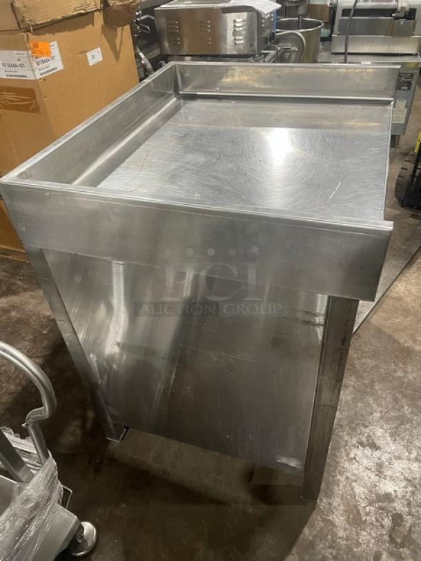 Commercial stainless steel worktop table with enclosed cabinet, up-turned back and side splash, on legs. Excellent condition.