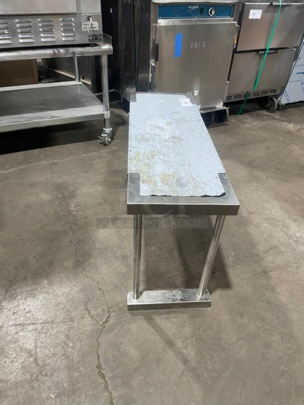 BK Resources stainless steel 36"x12" overhead shelf, model BK-OSS-1236. Features durable construction; slight surface wear.