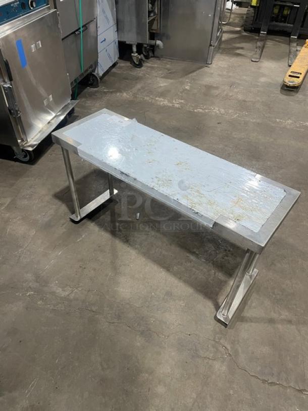 BK Resources stainless steel 36"x12" overhead shelf, model BK-OSS-1236, in good condition with protective film.