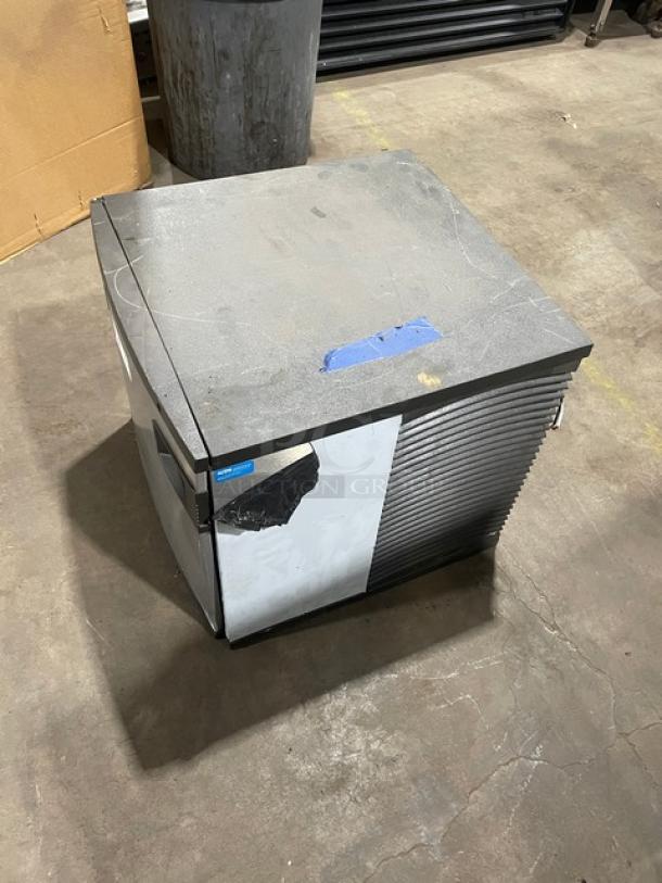Manitowoc stainless steel ice machine head, electric-powered, 1 phase, SN: 1101279892, shows visible wear.