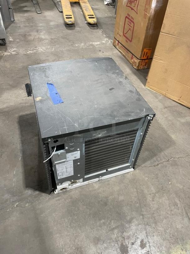 Manitowoc stainless steel electric ice machine head, SN: 1101279892, 1 phase, commercial use, visible wear marks.