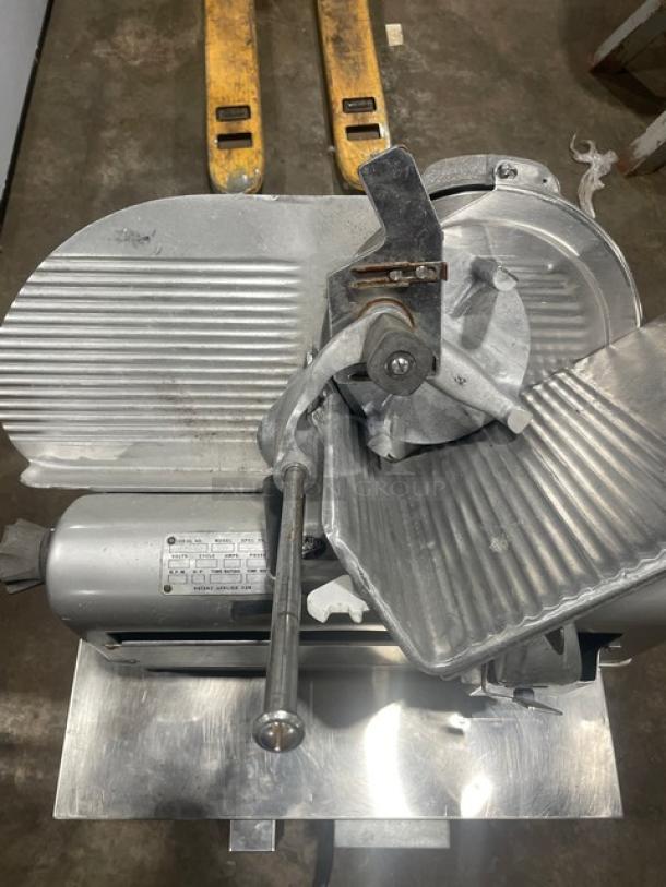 Commercial electric deli meat slicer, Model 1712, SN: 1624705, 115V, 1 Phase. Used condition, on legs, visible controls.