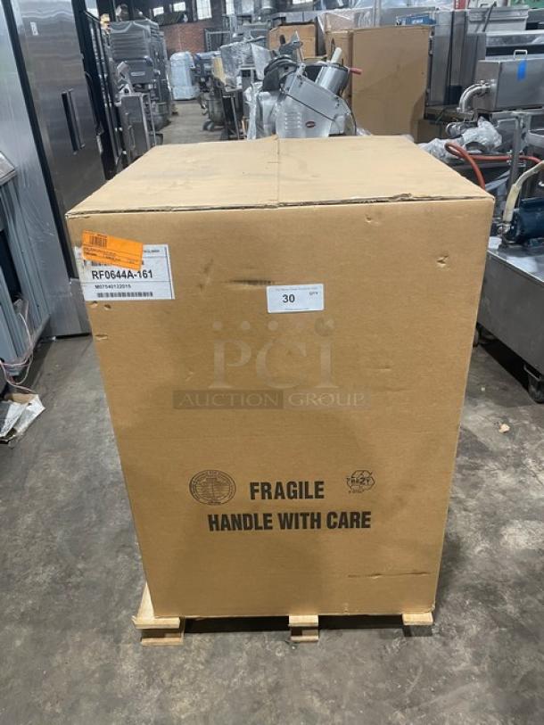 New Manitowoc ice maker RF0644A in box. Flake-style, air-cooled, electric, 115V, with legs. Box marked fragile.