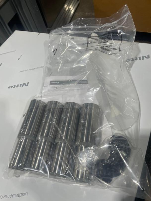 New Manitowoc RF0644A ice machine legs in sealed packaging; model and serial number visible on label.