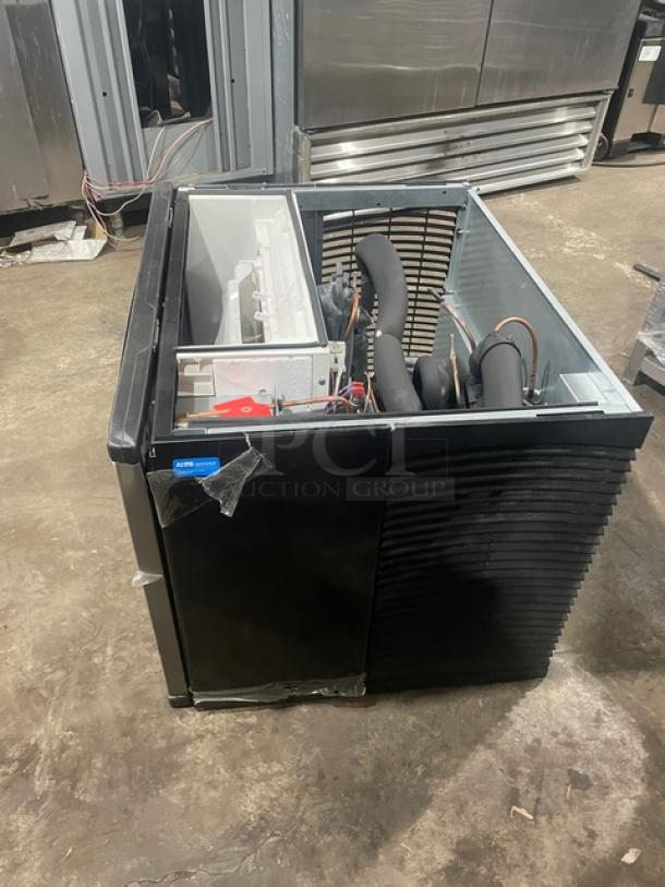 Manitowoc stainless steel ice machine head, model KYT0400W161, electric-powered, water-cooled, new with scratches.