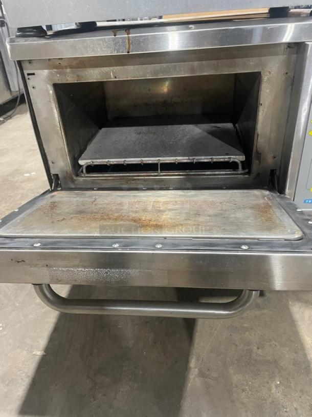 TurboChef NGC Commercial Stainless Steel Ventless Oven with digital controls, on legs, visible wear on door and interior.