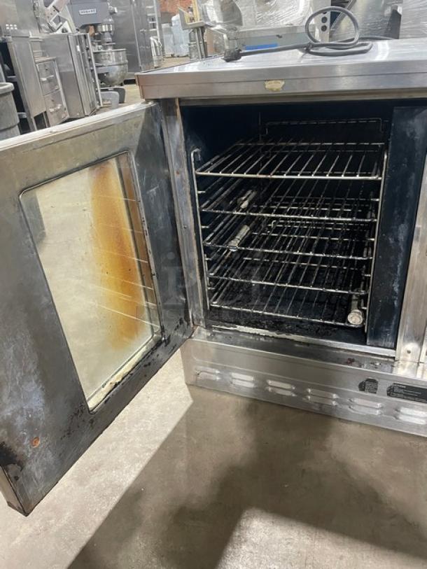 Blodgett stainless steel half-size convection oven, natural gas powered, with solid-state thermostat and wired oven rack. Used condition.